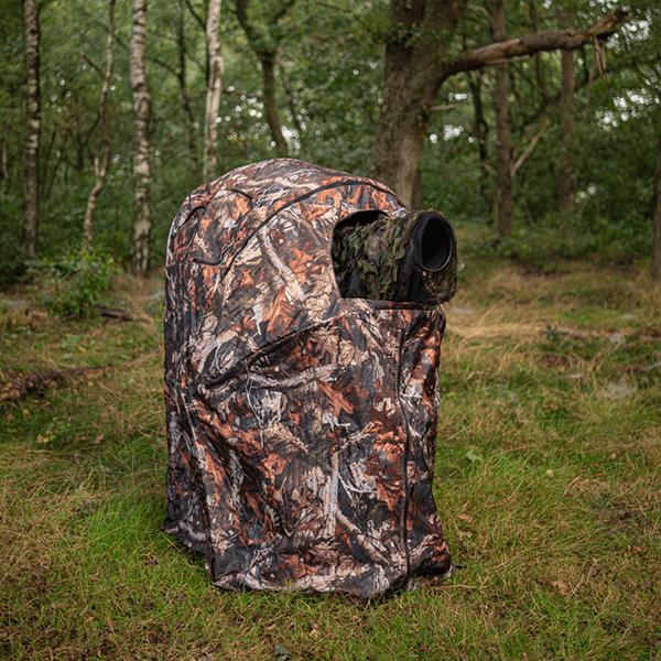 Camouflage tent for photography with chair