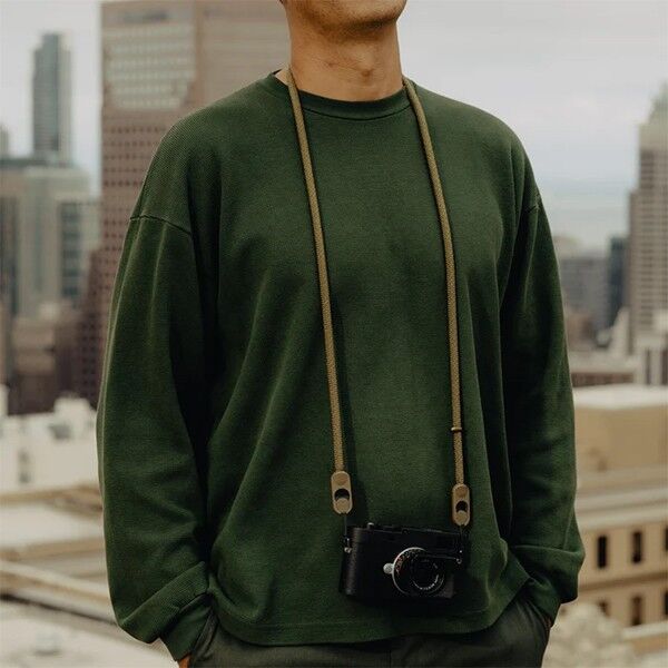 Wear view of the Peak Design Form Rope camera strap in Kelp