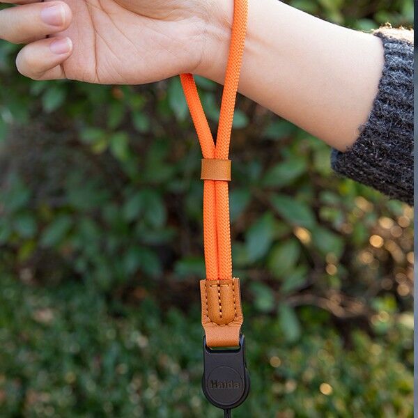 Overall view of the Haida wrist strap in orange