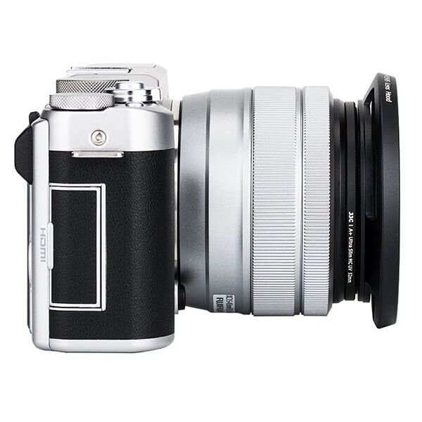 Fujifilm camera with lens hood attached side view