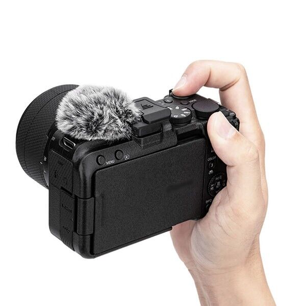 CSW-R50V wind muff mounted on Canon EOS R50 V camera in hand