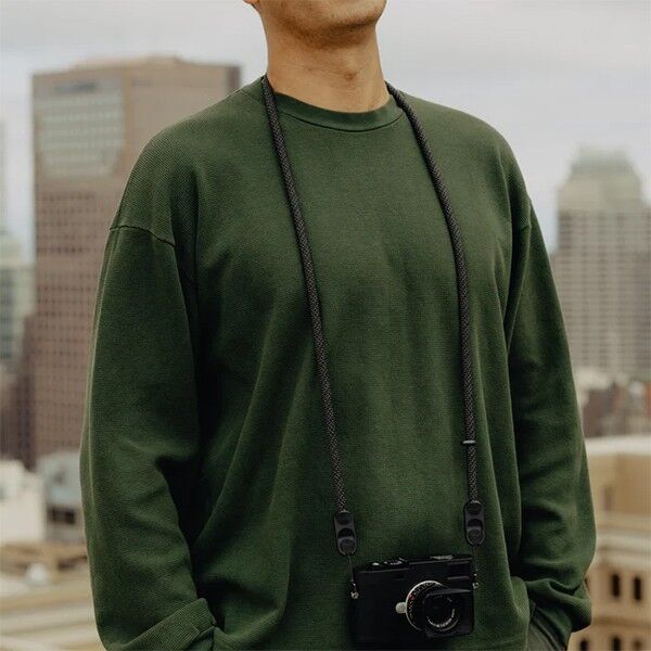 Wear view of the Peak Design Form Rope camera strap in black