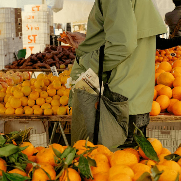 Peak Design bag in Sage in everyday use while shopping