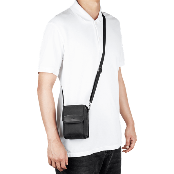 Bag for compact camera in black from JJC shown in use